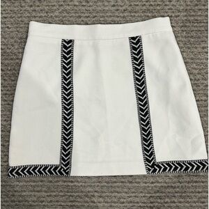 SHEIKE White mini skirt with black embroidery trim, EUC!